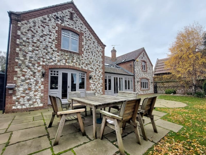 A well-maintained second home managed by The Norfolk Cleaning Group, featuring clean gutters and fascias, showcasing their commitment to property care and management.